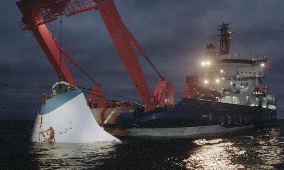 The bow door of the Estonia is lifted from the sea in November 1994