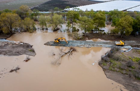 A breached levee being repaired on the Pajaro River in Monterey county on 14 March.