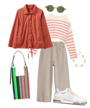 Burnt orange jacket, coral and cream striped jumper, beige denim jeans, gold bracelet, round sunglasses, striped tote bag and white trainers