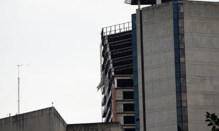 Part of the abandoned skyscraper Torre de David leans precariously in Caracas after the quake.