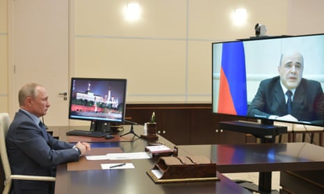 The Russian president, Vladimir Putin, speaks with Mikhail Mishustin on 30 April.