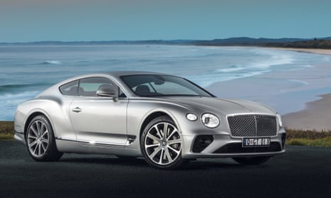 Bentley Continental GT silver shot against a coastal scene
