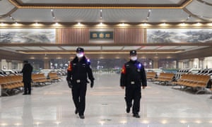 Police are patrolling Xi'an's empty railway station after a city-wide blockade was imposed to stop the spread of Covid-19 coronavirus on December 23.