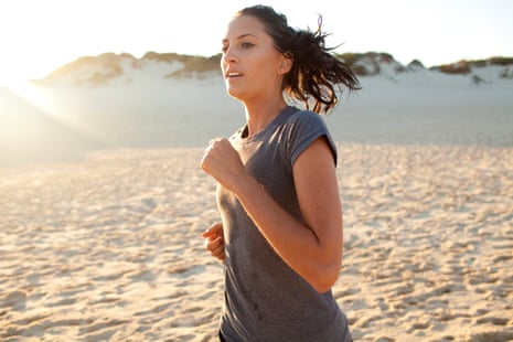 Young woman running at sunset on Australian beach