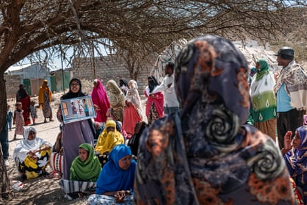 A woman teaches people in a camp in Borama about weapons safety and dangers from unexploded landmines.