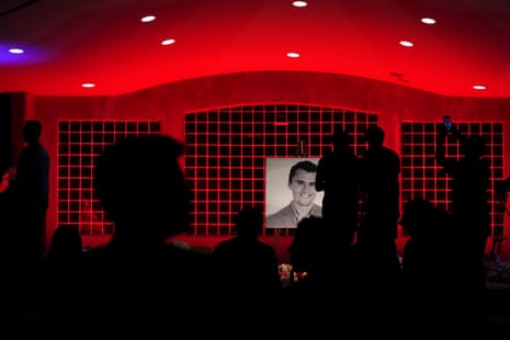 silhouettes of people looking at a screen on stage silhouettes of people looking at a screen on stage
