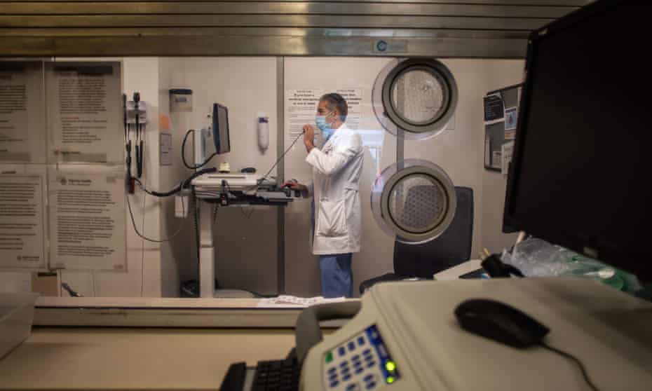 Doctor Ali Jamehdor, Chief Director of the Emergency Room of the Dignity Health - St. Mary Medical Center, works in a small room next to the triage tent for patients with Covid-19 symptoms in Long Beach, California