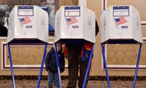 A voter casts his ballot in the midterm election at a polling station in the Brooklyn borough of New York City on 6 November 2018.