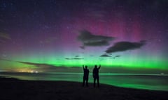 The northern lights over Bamburgh Castle beach in Northumberland