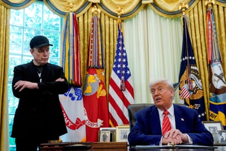 two men in suits in a gilded office