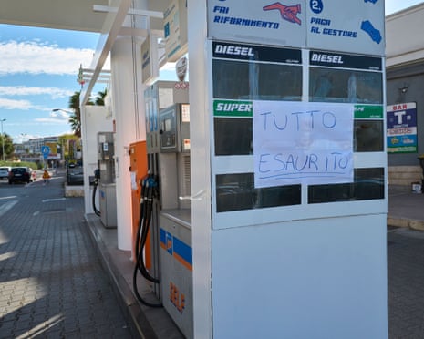 A handwritten "all sold out" sign covers a price board at a Puglia petrol station