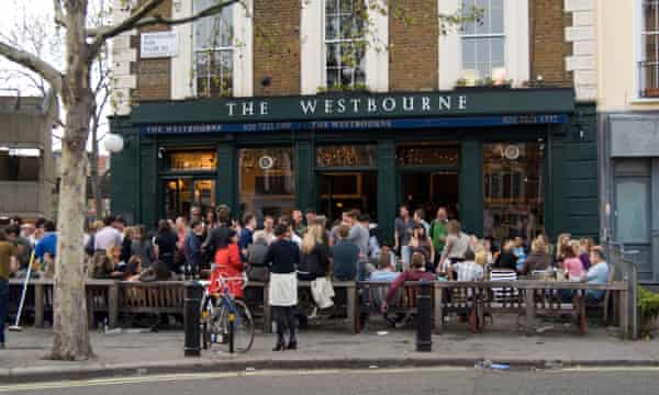 People drinking outside The Westbourne pub