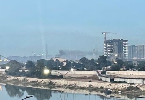 Smoke rises following a drone attack on the US embassy in Baghdad on 14 March 2026.
