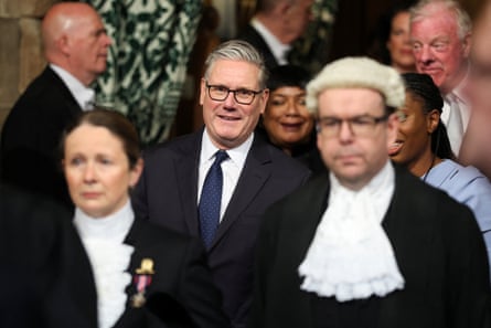 Keir Starmer walks through the House of Commons with the Conservative leader, Kemi Badenoch