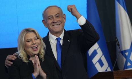 Head of the Likud party, Benjamin Netanyahu, and his wife Sara celebrate exit poll results on Wednesday.