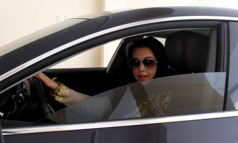 Daniah al-Ghalbi, a newly-licensed Saudi woman driver, sits in her car during a test-drive in the Red Sea resort of Jeddah