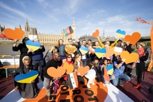 Protesters sail past Westminster demonstrating against the bill to send refugees out of the UK