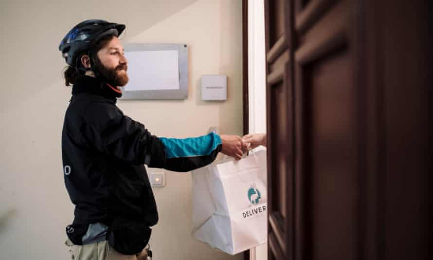 Your dinner, sir … a Deliveroo rider doing his job.