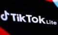 Close up of screen reading TikTok Lite in white writing on black background.