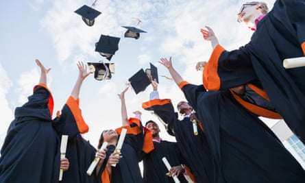 Graduates throw their caps in the air