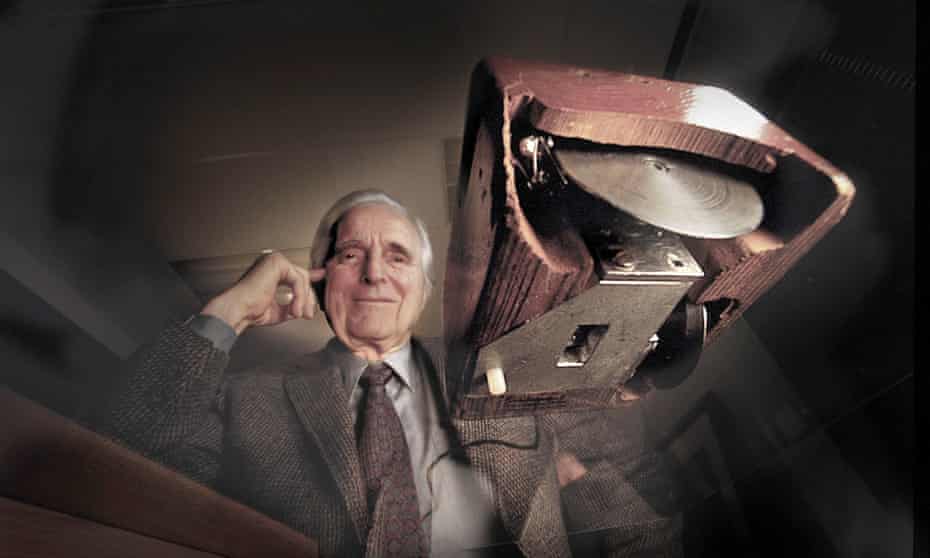 Douglas Engelbart, a pioneer of the human-computer interface, with his prototype wooden mouse.