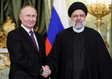 Russian president Vladimir Putin shakes hands with Iranian president Ebrahim Raisi during a meeting in Moscow in December 2023.