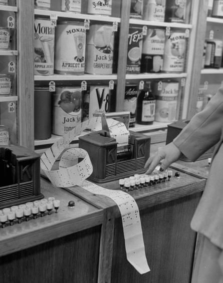 Keedoozle automatic grocery store with a customer using the key to select products she wishes to purchase.