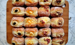 An array of doughnuts laid out on a platter at Twelve Triangles, Edinburgh, Scotland.