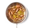 Garlic and prawn shells in a frying pan