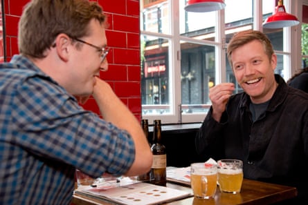 Joe and Stuart chatting and laughing across the restaurant table