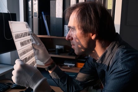 Arthur Bondar examines some of his negatives.