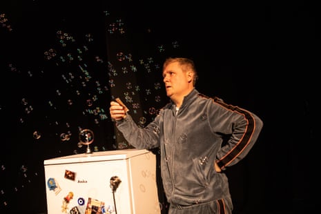 Tim Key performing his act “Mulberry” at the Soho Theatre, in which he talked about in his velour tracksuit read his little poems and talked about his experience in lockdown. He stands next to a fridge pondering.