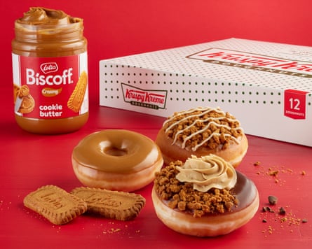 Doughnuts alongside Biscoff biscuits, pinch a jar aliases Biscoff dispersed and a doughnut box