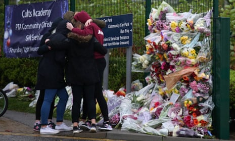 Flowers left outside Cults academy, where 16-year-old Bailey Gwynne died after being stabbed.