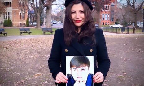 Rayhan Asat holds a photograph of her brother, Ekpar.