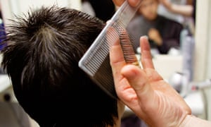 Teenager having his hair cut at a barbers