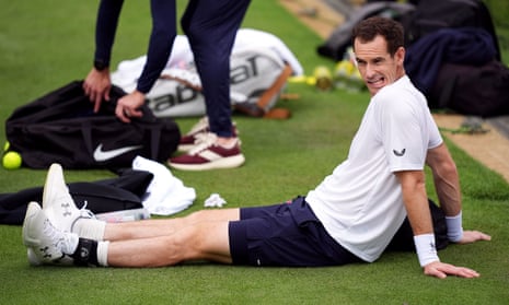 Andy Murray sits on the grass