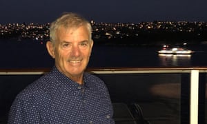 man on cruise ship with ocean in background