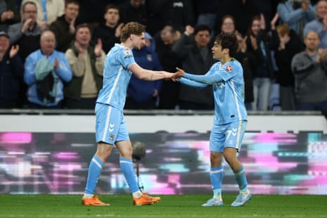 Jack Rudoni (left) celebrates with teammate Tatsuhiro Sakamoto after scoring his second goal of the game and putting Coventry City 3-2 ahead.