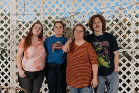 a family stands for a photograph