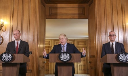 Boris Johnson flanked by Chris Whitty, left, and Patrick Vallance, during a news conference 3 March.