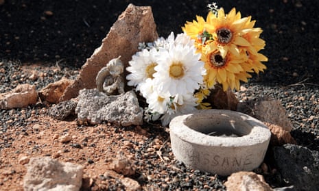 Flowers and other items at the grave of Alhassane Bangoura in Teguise, Lanzarote