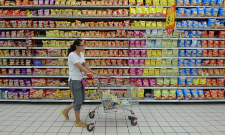 A customer shops for groceries at a supermarket in Fuyang, eastern China