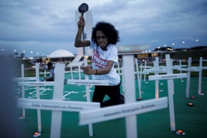 Greenpeace activists set up crosses in Brasília in memory of people killed during conflicts in the Amazon.