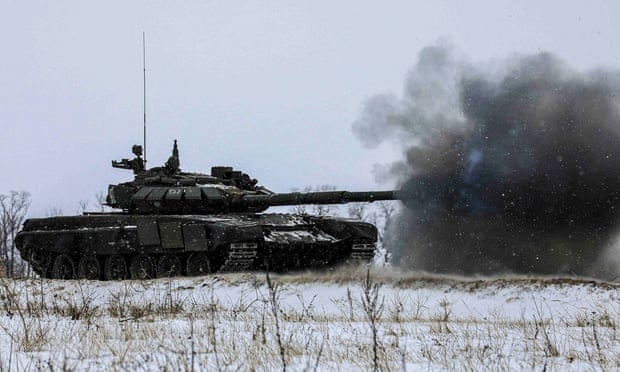A Russian tank fires during military exercises in the Leningrad region in a picture released on 14 February.