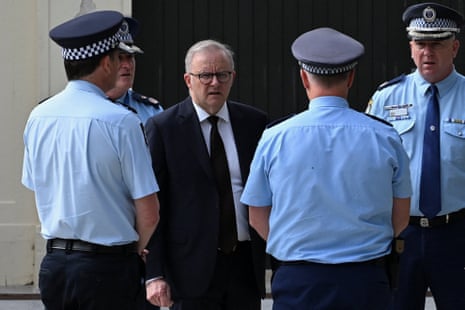 Anthony Albanese speaks to police at the scene of the attack