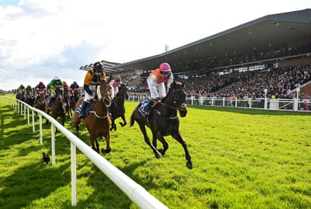 Haiti Couleurs, with Sean Bowen up, right, alongside runners and riders on the first time round before going on to win the Irish Grand National Chase at the Fairyhouse Easter Festival in April.