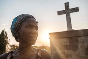 Margaret Labol, 50, who lost 15 family members and her husband, a Uganda People’s Defence Force (UPDF) soldier, during the Lukodi massacre by the Lord’s Resistance Army in 2004, poses for a portrait in front of the memorial for the victims of the massacre in Lukodi, Uganda, 3 February 2021.