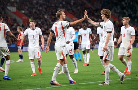 Harry Kane celebrates with teammate Anthony Gordon after scoring his team’s second goal against Czechia.
