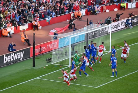 Leandro Trossard of Arsenal (bottom) celebrates Arsenal’s third goal against Leicester – later ruled to be an own goal by Wilfried Ndidi (No 6) – at the Emirates Stadium